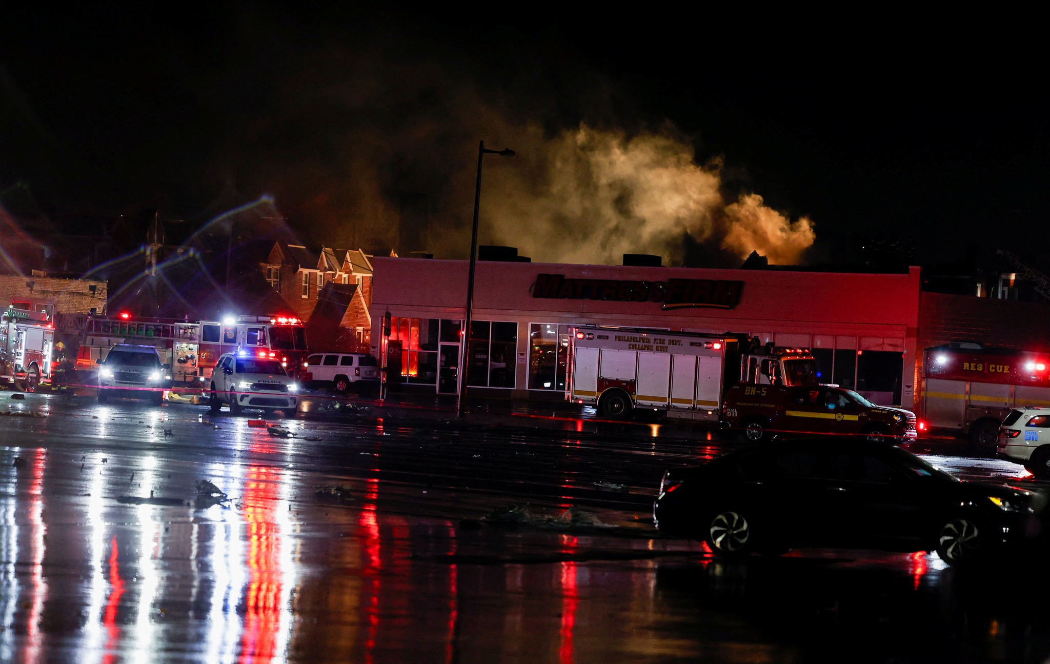 Smoke rises as emergency personnel operate at the site of a plane crash in Philadelphia, Pennsylvania, U.S., January 31, 2025. REUTERS/Rachel Wisniewski