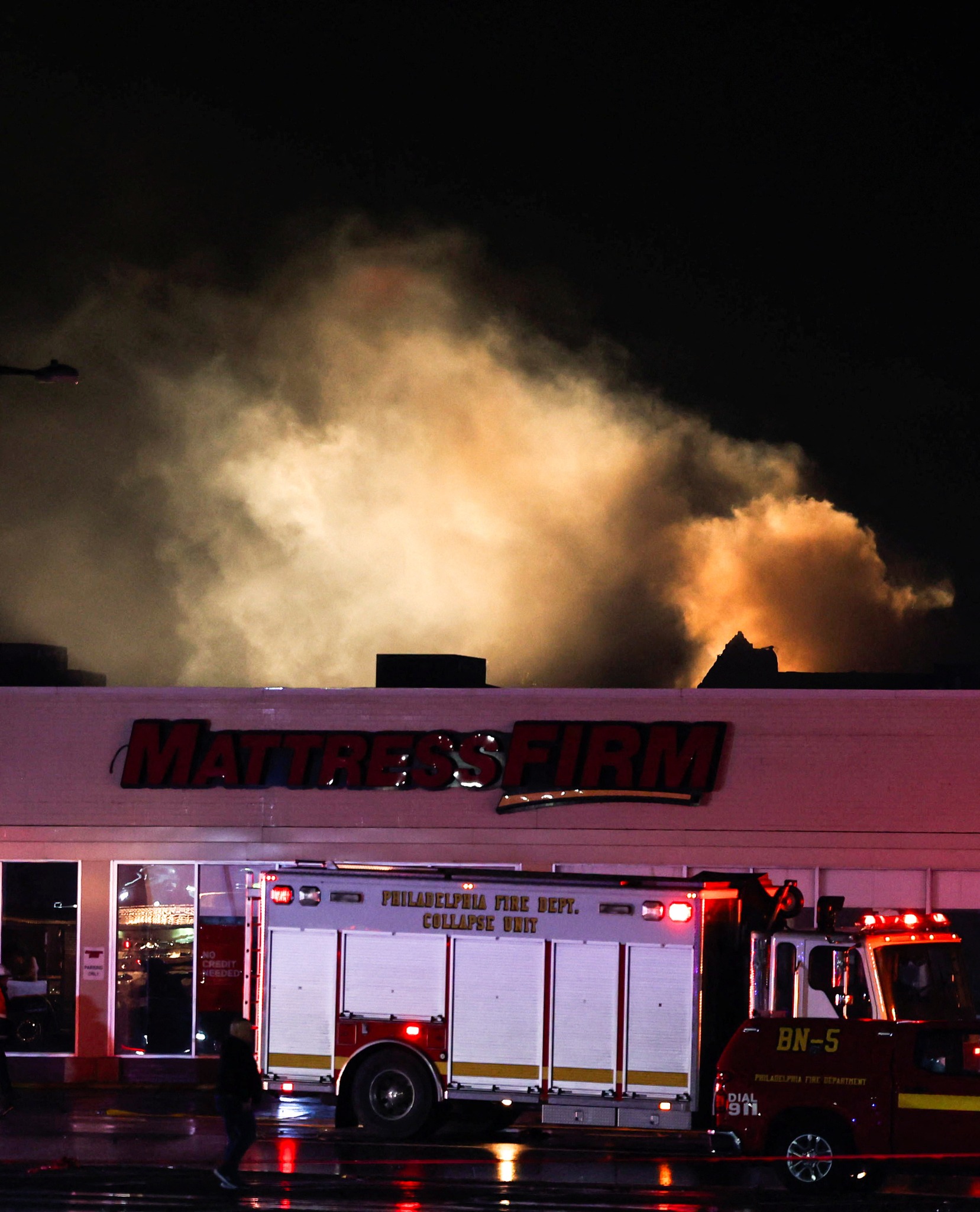 Smoke rises as emergency personnel operate in the aftermath of a plane crash in Philadelphia, Pennsylvania, U.S., January 31, 2025. REUTERS/Rachel Wisniewski